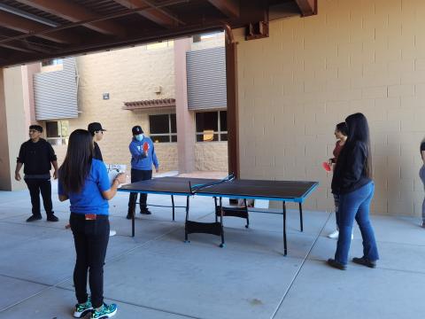 Students are learning the national sports-Pingpong by hands-on practice.
