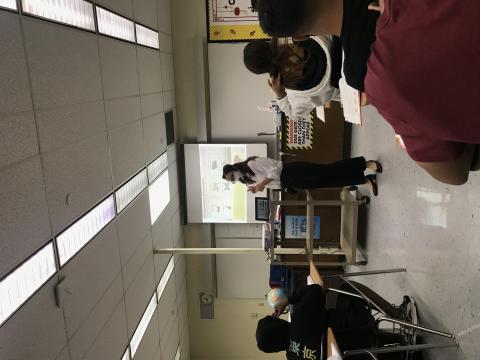 the teacher is giving instructions on the four tones of Chinese.