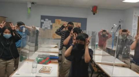 Students are showing rabbit with guesture.