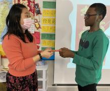Student receives the red envelop.