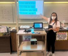 The teacher is explaining the sentences concerning ordering food in Chinese