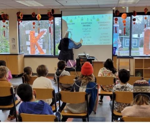 TCLP exchange teacher Ola Sofi presents to students at the German International School.