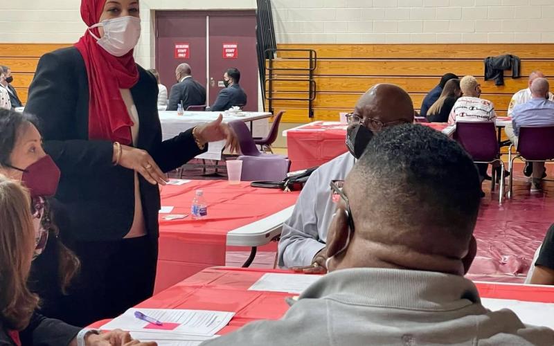 Ms. Ghazaly converses about her culture with Fayetteville community members.